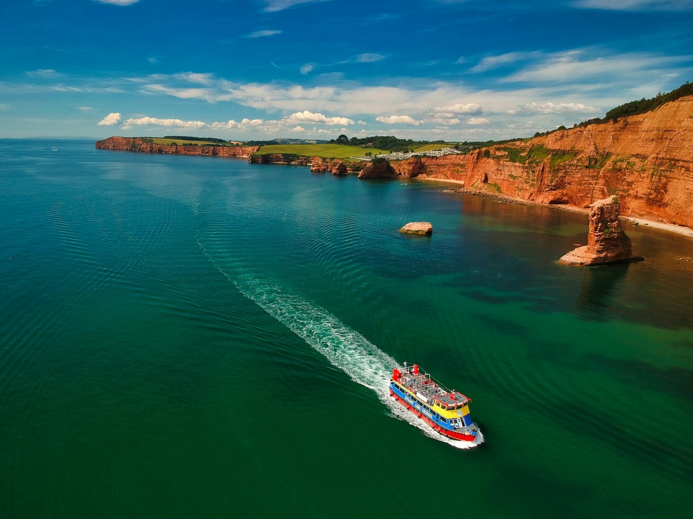 Rocky coastline meeting bright blue Caribbean water